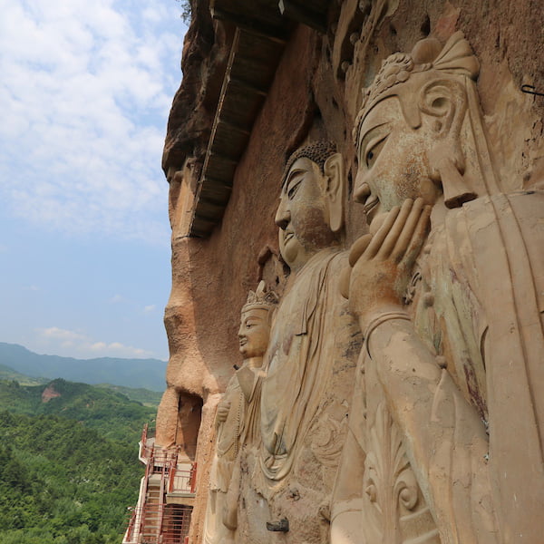 visit maijishan grottoes with a museum researcher